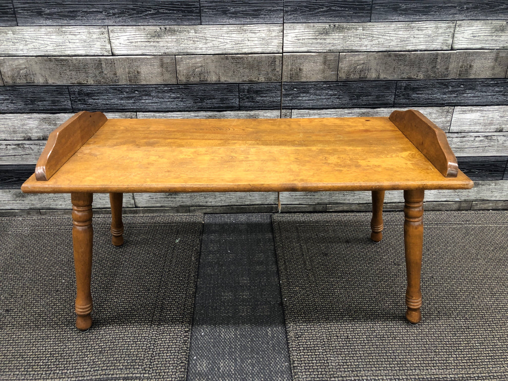 VTG SHORT WOODEN COFFEE TABLE W/RAISED SIDES.