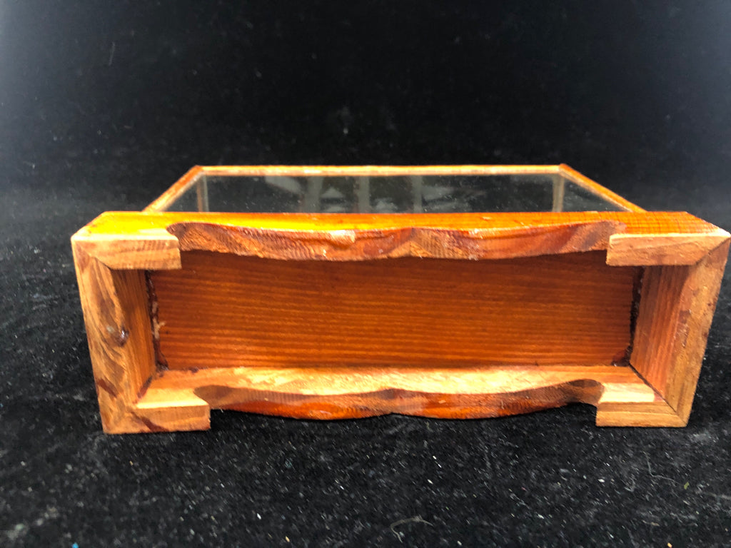 SMALL SHIP IN GLASS CASE.
