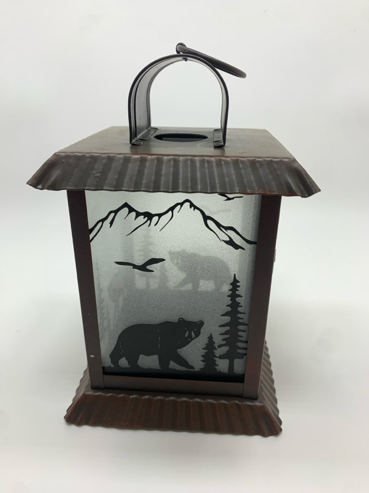 BROWN METAL LANTERN W/BEAR FOREST GLASS.