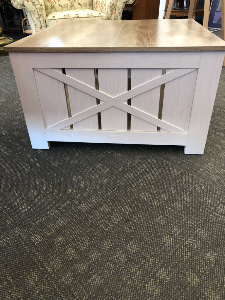 GRAY COFFEE TABLE W/CROSSED DESIGN & WOOD TOP.
