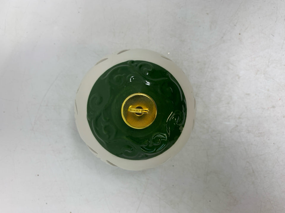 CIRCLE PIERCED LIGHT UP CERAMIC ORNAMENT.