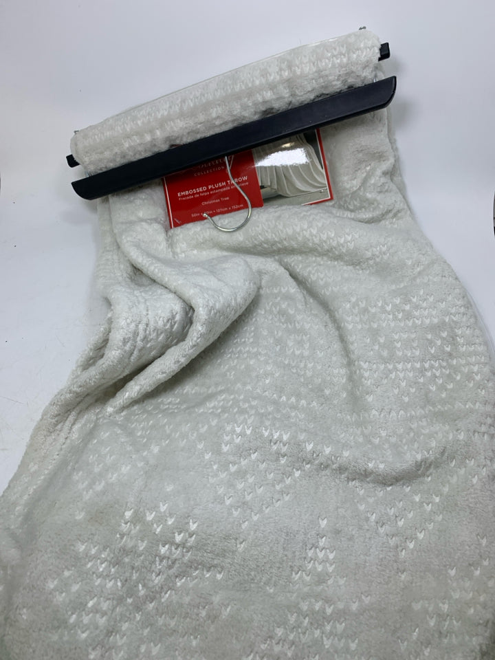NIP IVORY EMBOSSED CHRISTMAS TREES THROW.