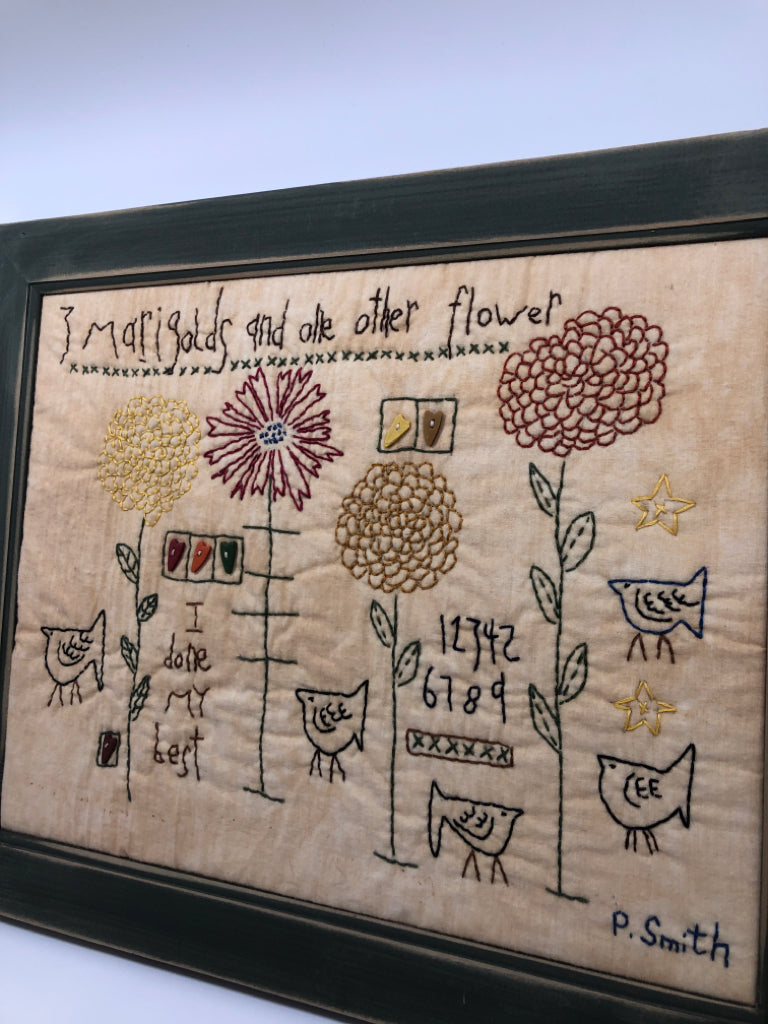 PRIMITIVE 3 MARIGOLDS KNITTED IN GREEN FRAME.
