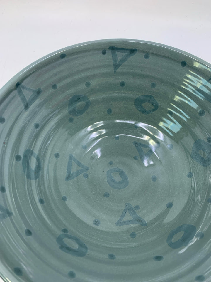 FOOTED TERRA COTTA SERVING BOW W/ BLUE GLAZED INSIDE W/ SHAPES.