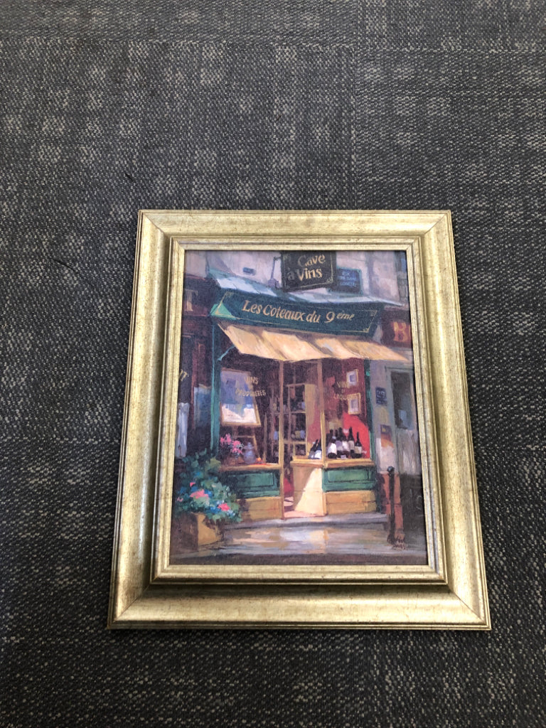 CAFE PAINTING IN GOLD FRAME.