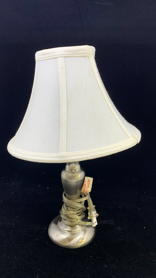 SILVER BASE TABLE LAMP W/WHITE SHADE.