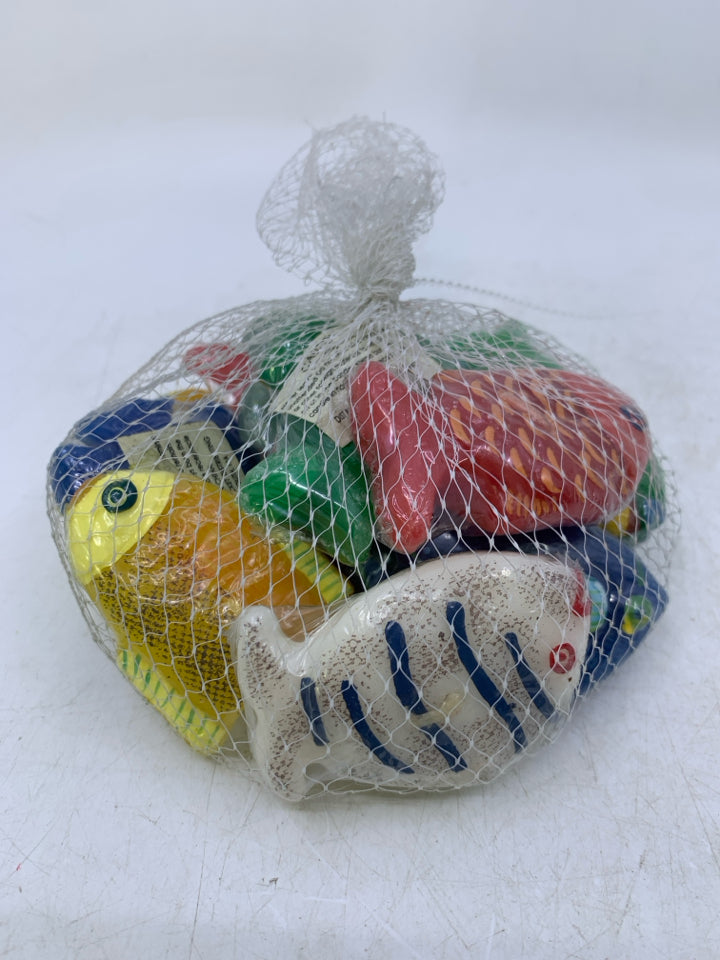 NIP ASSORTED FISH TEA LIGHT CANDLES IN NET BAG.