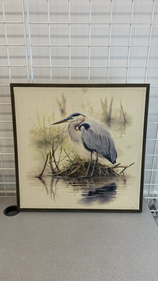 BLUE HERON CANVAS IN BROWN FRAME.