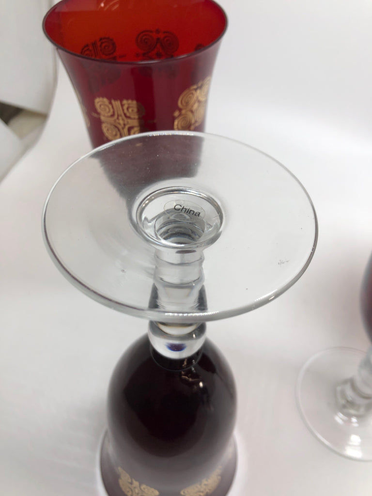 4 RUBY RED GOBLET WITH GOLD SWIRL DESIGN.