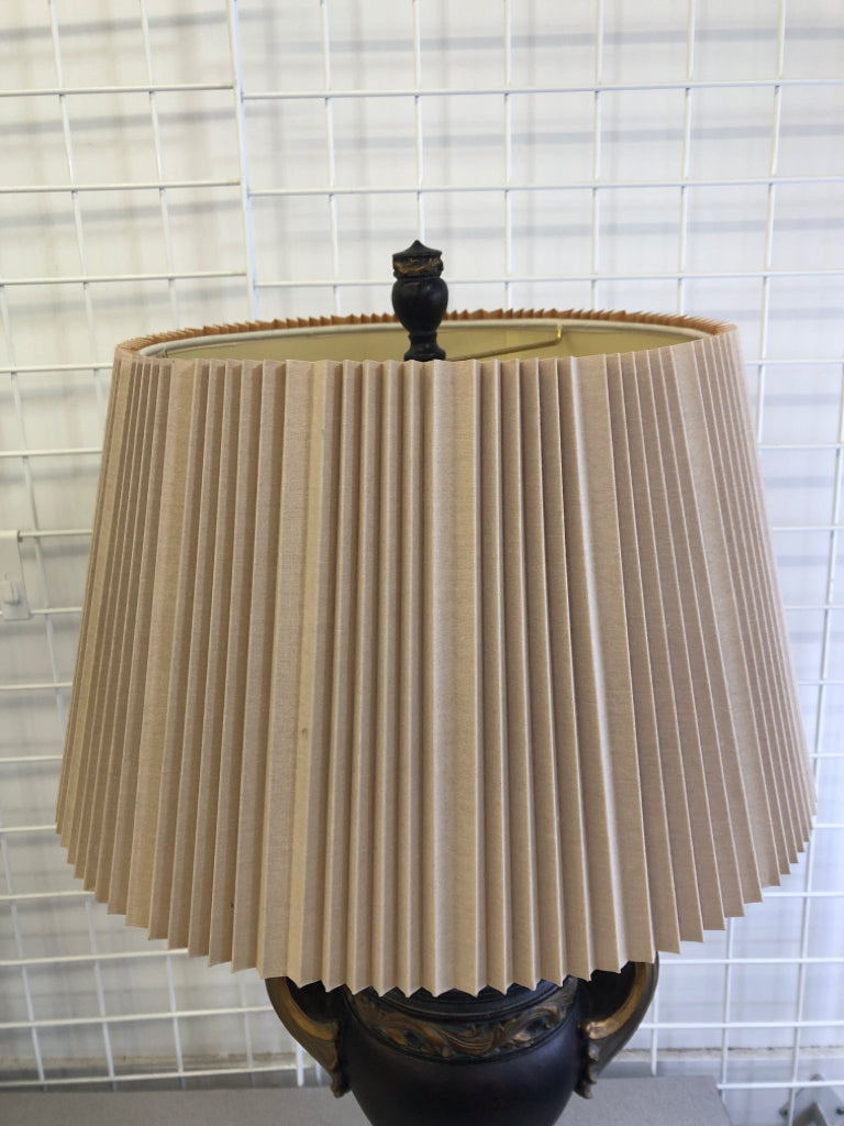 BROWN/GOLD LEAF LAMP BASE W/TAN ACCORDION SHADE.