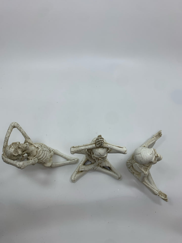 3 YOGA RESIN SKELETONS.