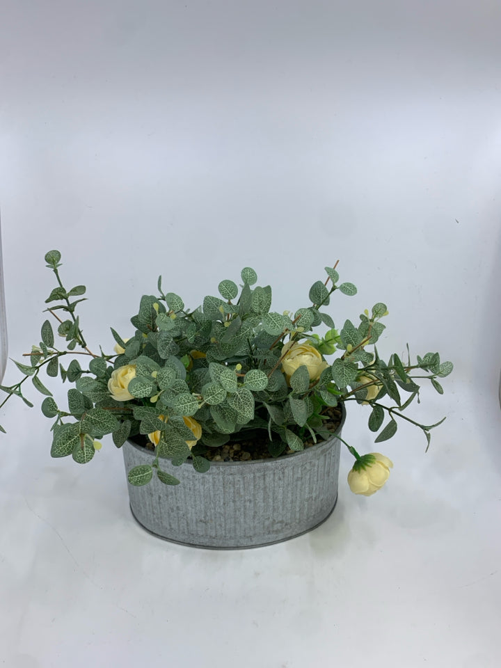 FAUX LEAVES & CREAM FLOWERS IN GALVANIZED TIN.