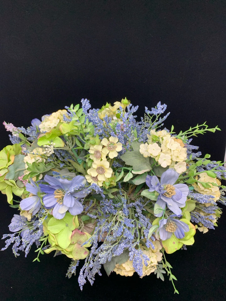 BLUE FLORALS IN WHITE PLANTER.