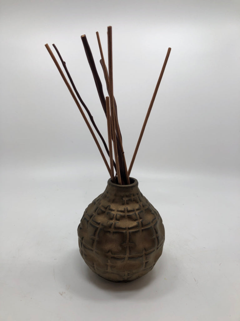 ROUND BRASS PAINTED BUD VASE W/FAUX TWIGS.