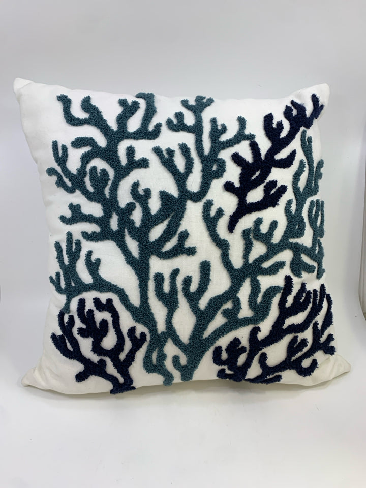 WHITE ACCENT PILLOW W/NAVY CORAL DESIGN.
