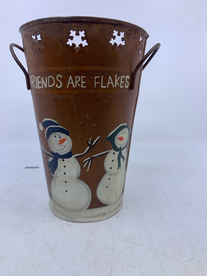 METAL BUCKET VASE W/ PRIMITIVE STYLE SNOWMAN W/ PIERCED SNOWFLAKES.