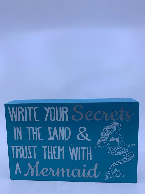 "WRITE YOUR SECRETS" WHITE WRITING BLUE BACKGROUND MERMAID ON IT.