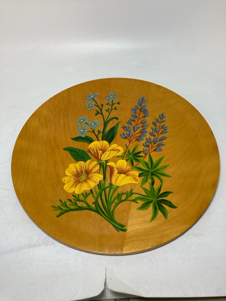 WOOD GLAZED CIRCLE W/ PLANTED FLOWERS.