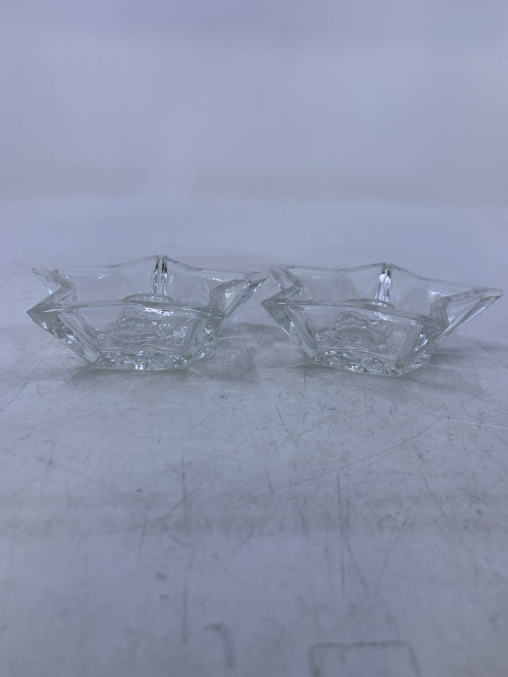 2 CLEAR GLASS STAR SHAPED TAPERED CANDLE HOLDERS.