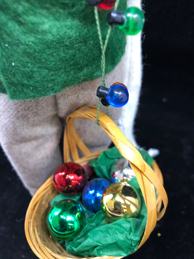 BYERS' CHOICE MAN HOLDING CHRISTMAS TREE- 1996.