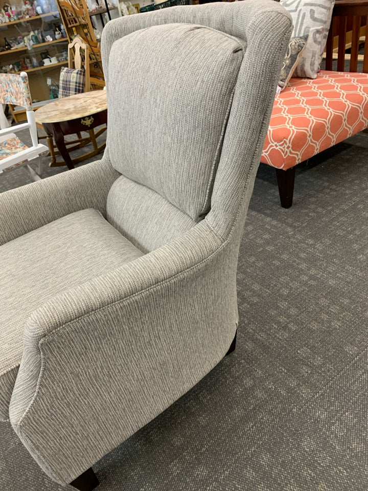 TAN UPHOLSTERED LOREN ARM CHAIR W/WOOD LEGS.