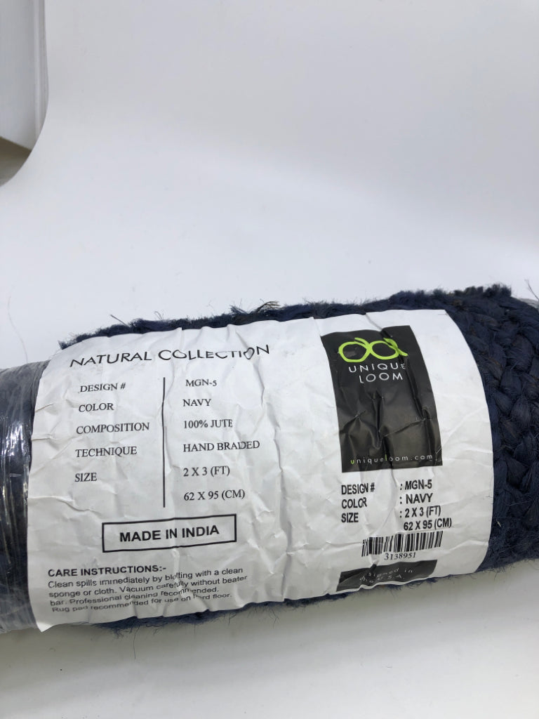 NIP NAVY BLUE RUG.