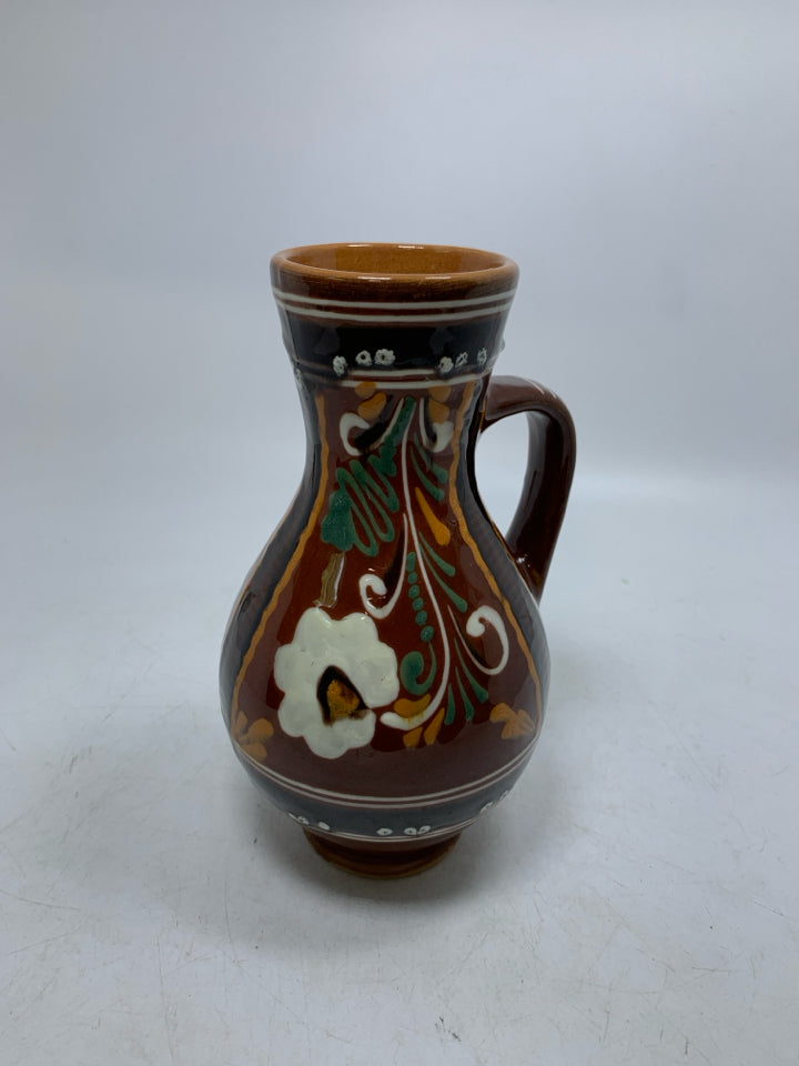 DARK BROWN PITCHER W/ DETAILED FLORAL DESIGN TERRA COTTA.