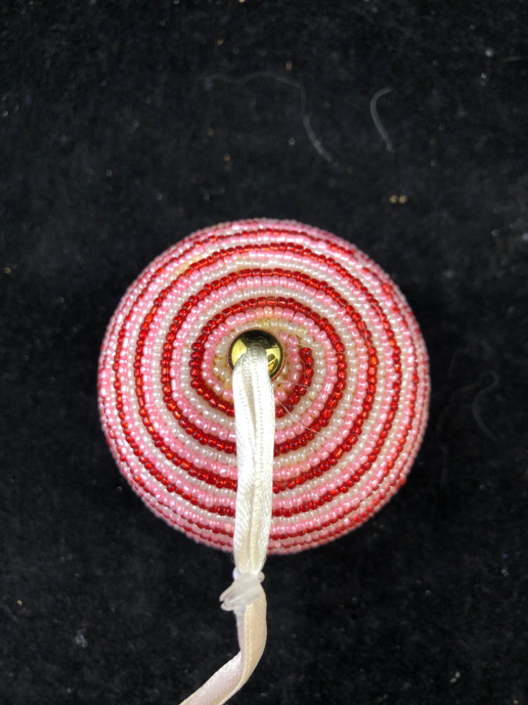 RED/PINK/WHITE STRIPE BEADED ORNAMENT.