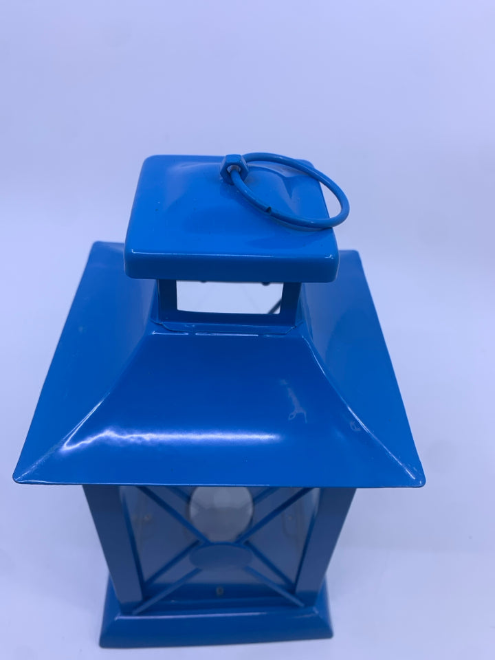BLUE METAL TEA LIGHT LANTERN.