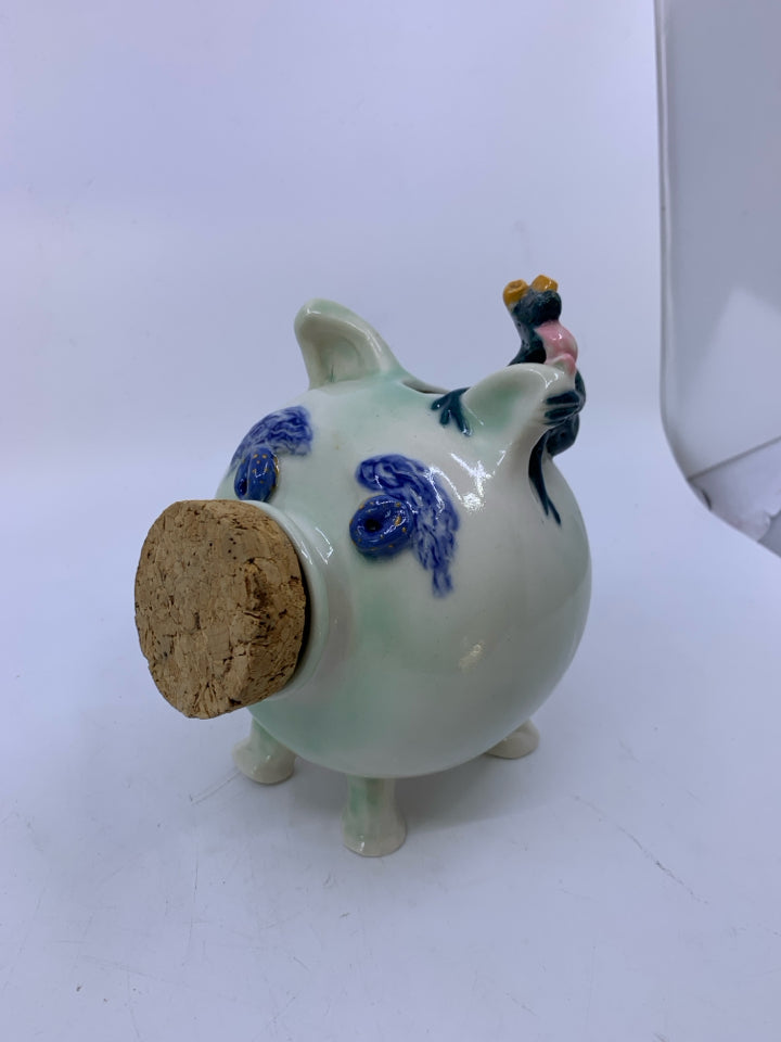 MINT GREEN POTTERY PIGGY BANK W/ CORK NOSE/ FROG LICKING EAR.