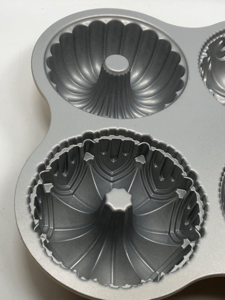 4 CAVITY BUNDT QUARTET CAST ALUMINUM.