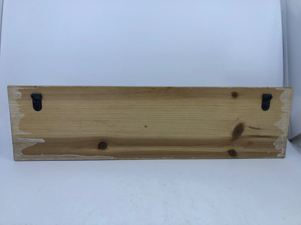 NUMBERED HOOKS ON WOOD WALL ART.