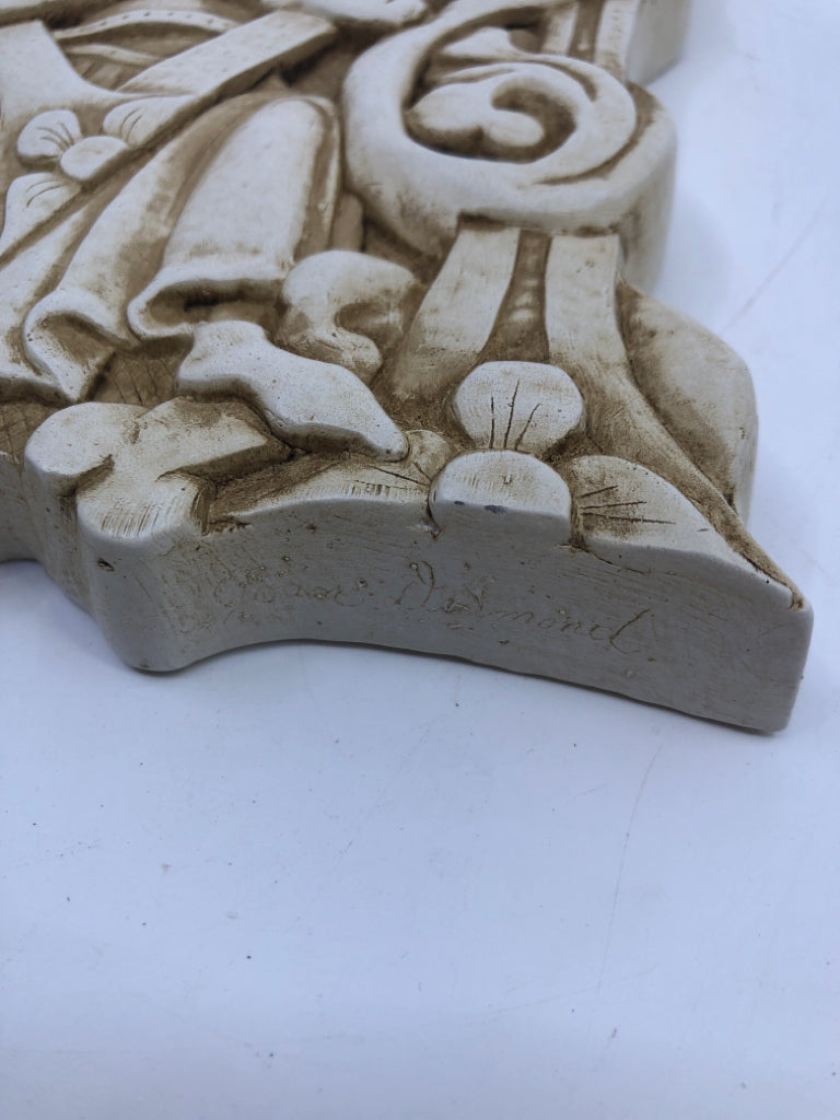 CERAMIC EMBOSSED KING IN CHAIR FLOWERS FACSIMILIES WALL HANGING.
