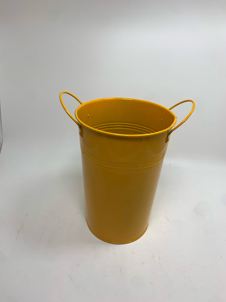 ORANGE METAL BUCKET.