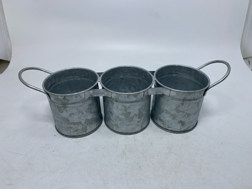 3 SMALL FUSED GALVANIZED PLANTERS.