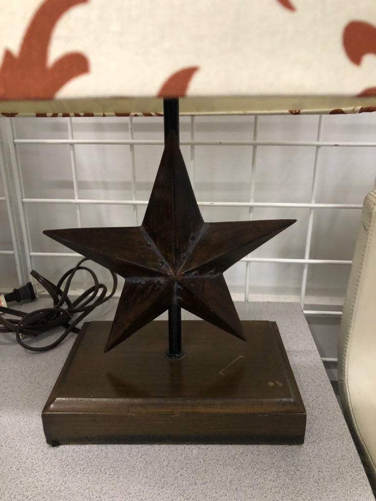 RUSTIC STAR LAMP W/ ORANGE+CREAM SHADE.