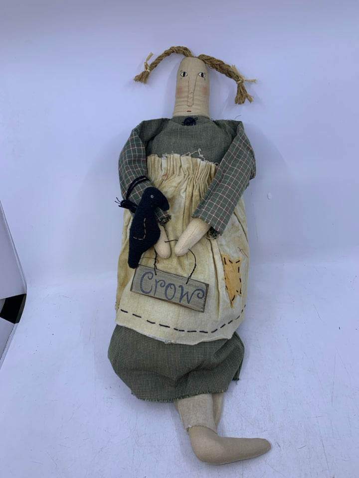 PLUSH WOMAN W/ GREEN DRESS GOLDING CROW SIGN.