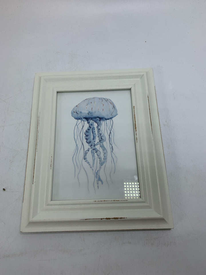 WHITE FRAME W/ JELLY FISH PICTURE.