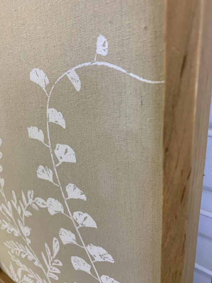 STAMPED WHITE FLOWER ON CANVAS IN WOOD FRAME.