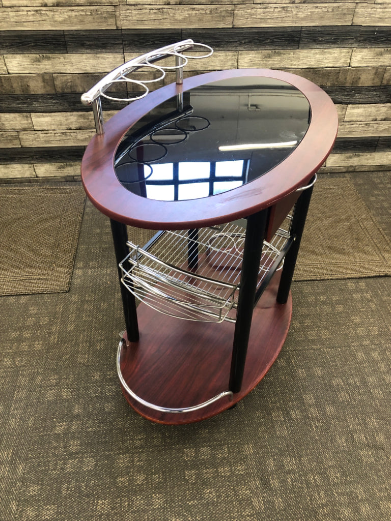 DK WOOD OVAL ROLLING BAR CART W/BLACK GLASS TOP.