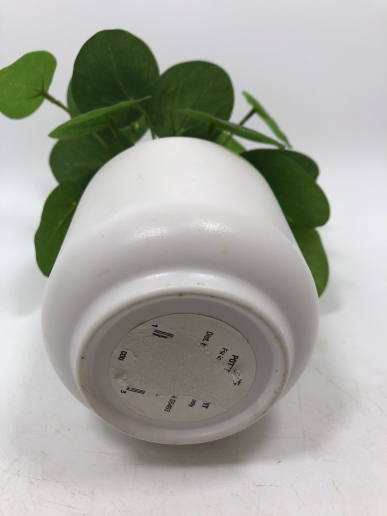 FAUX PLANT IN WHITE PLANTER.