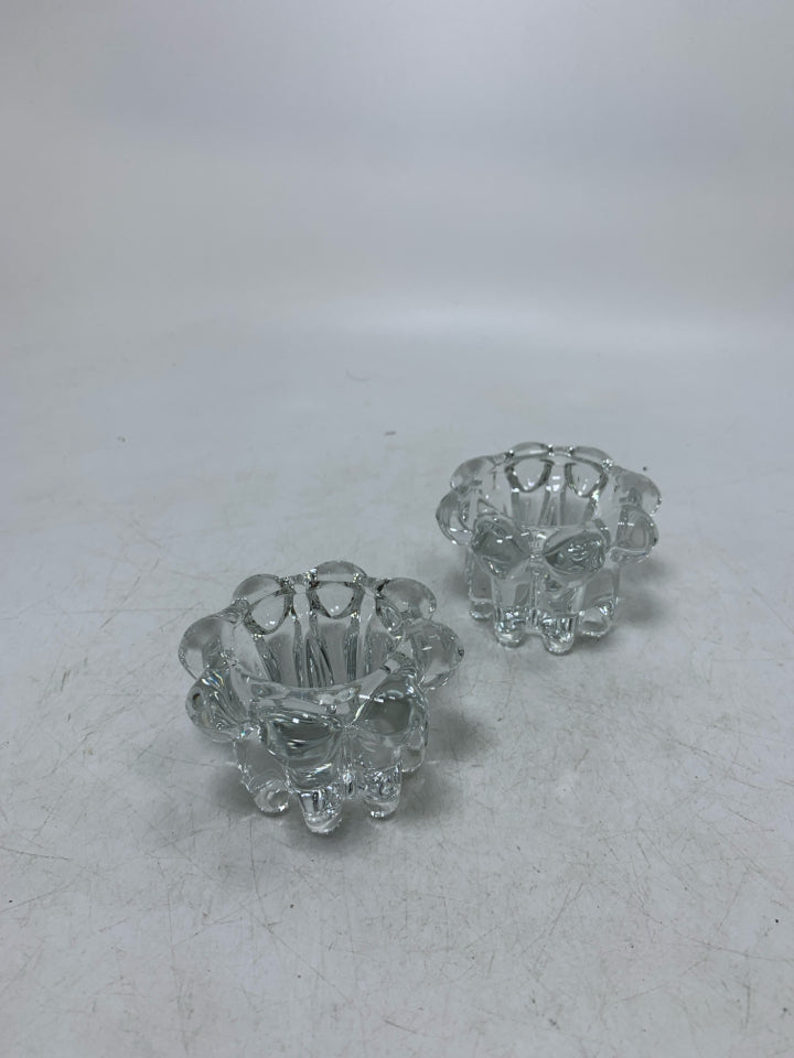 2 CLEAR GLASS TEA LIGHT HOLDERS W/ ROUNDED EDGES.