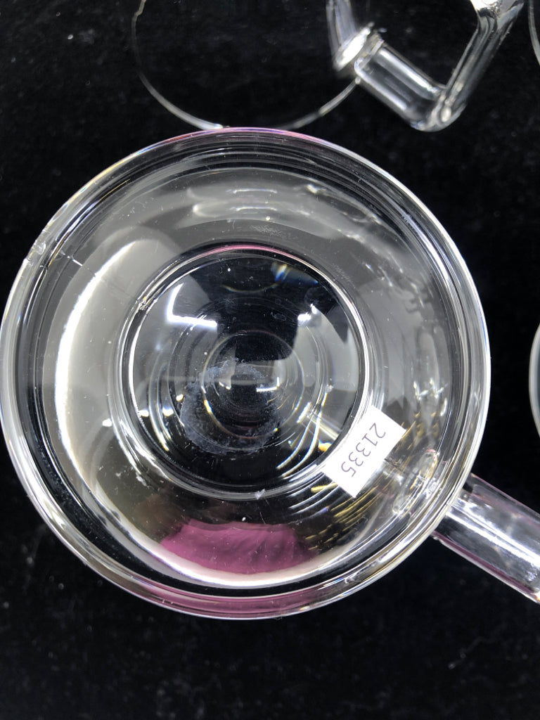 4 FOOTED GLASS MUGS.