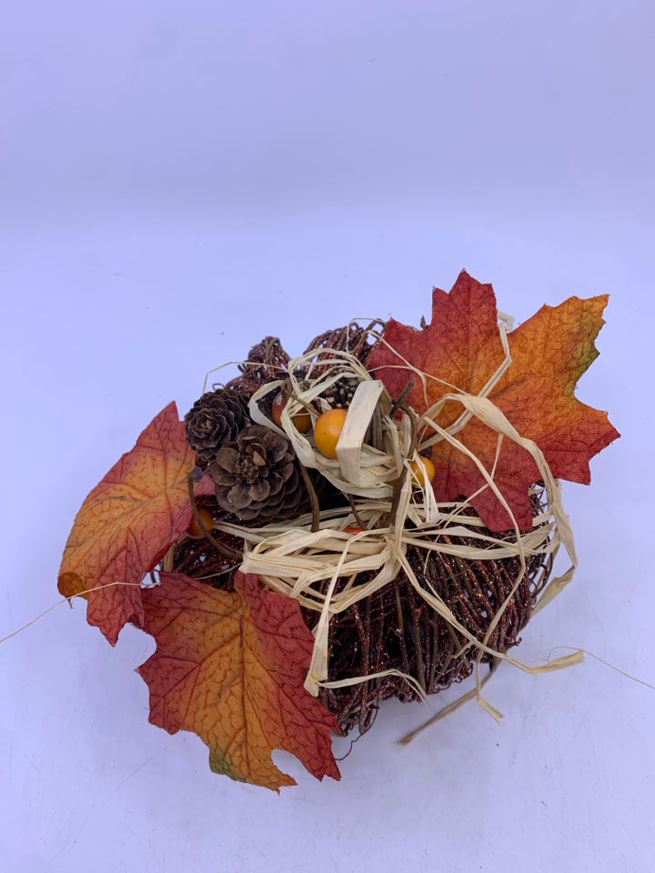 GLITTER TWIG PUMPKIN W/ PINECONES+LEAVES ON TOP.