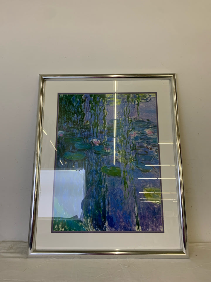 ABSTRACT LILY POND SCENE WALL HANGING IN SILVER FRAME.