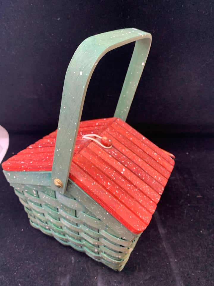 GREEN HOLIDAY BASKET W/ RED LID HOLLY DESIGN WHITE SPECKLES.