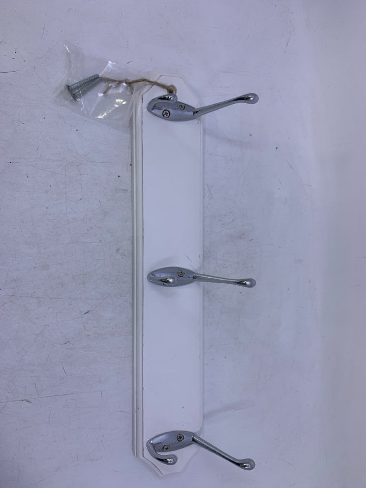 PAINTED WHITE WOOD BASE W/ 3 SILVER HOOKS WALL HANGING.