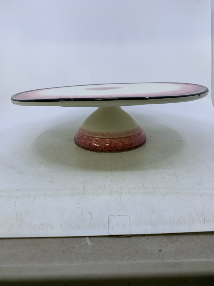 FOOTED CERAMIC CREAM/RED W/ HEART IN CENTER BLACK EDGE.