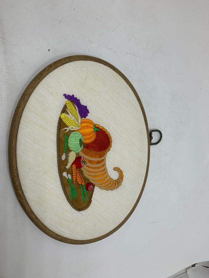 CORNUCOPIA EMBROIDERED OVAL WALL HANGING.