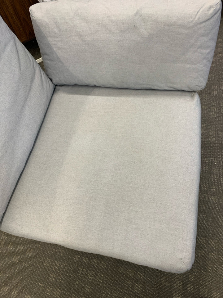 CORNER CHAIR W/WHITE WHITE METAL FRAME & 3 GRAY CUSHIONS.